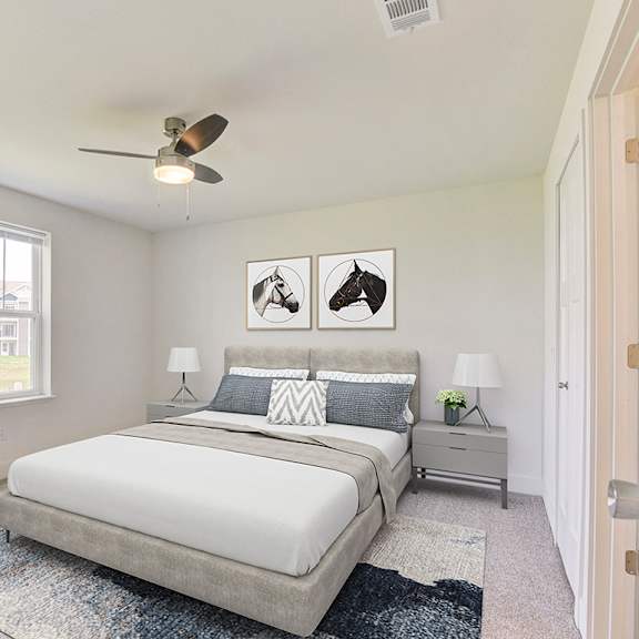 Thumbnail 17 of 20 A bedroom with a bed, nightstands, a window and a ceiling fan at Signature Pointe Apartment Homes, Athens