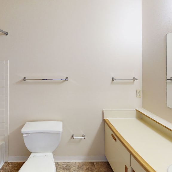 Thumbnail 7 of 8 A bathroom with a bathtub and shower at South Bridge Apartments, Fort Wayne