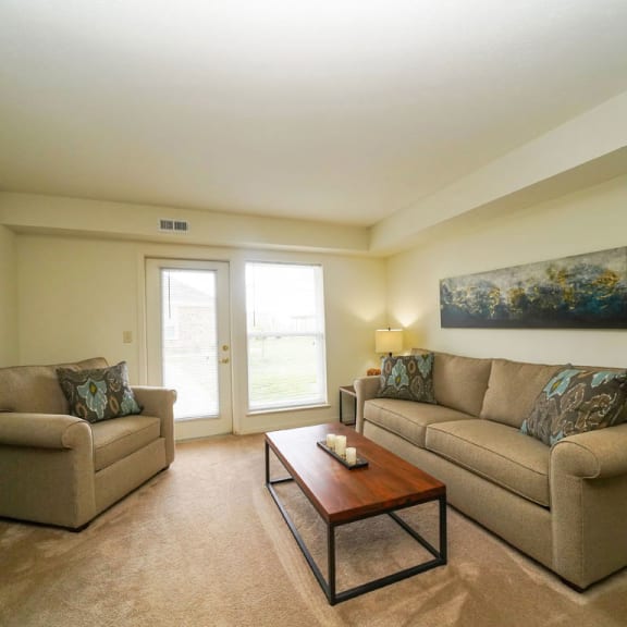 Thumbnail 3 of 10 a living room with two couches and a coffee table at Stoney Pointe Apartment Homes, Kansas