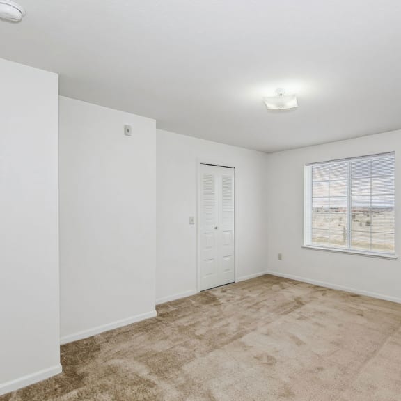 Thumbnail 9 of 13 spacious bedroom with carpet at Stoney Pointe Apartment Homes, Wichita, KS, 67226