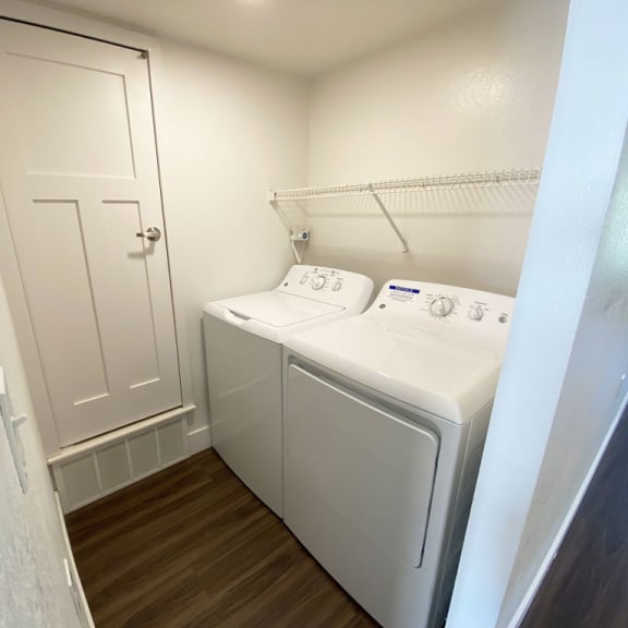 Thumbnail 6 of 13 a washer and dryer in laundry room at Stoney Pointe Apartment Homes, Wichita, KS