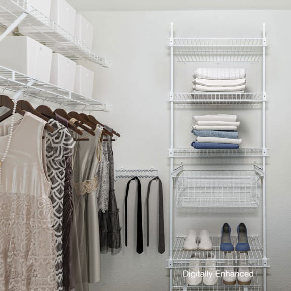 Thumbnail 10 of 13 a walk in closet with wardrobe organizers at Stoney Pointe Apartment Homes, Wichita