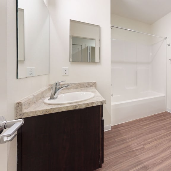 Thumbnail 10 of 14 a bathroom with a sink toilet and a shower at Strathmore Apartment Homes, West Des Moines