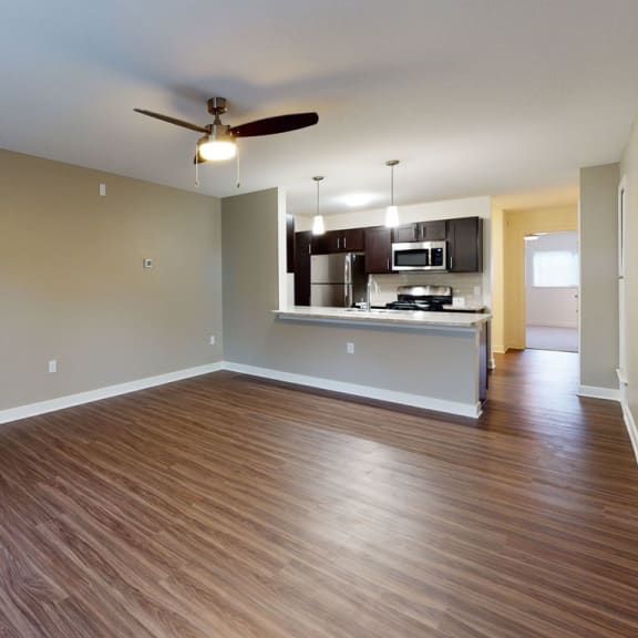 Thumbnail 6 of 14 A living room with hard surface flooring at Strathmore Apartment Homes, Iowa