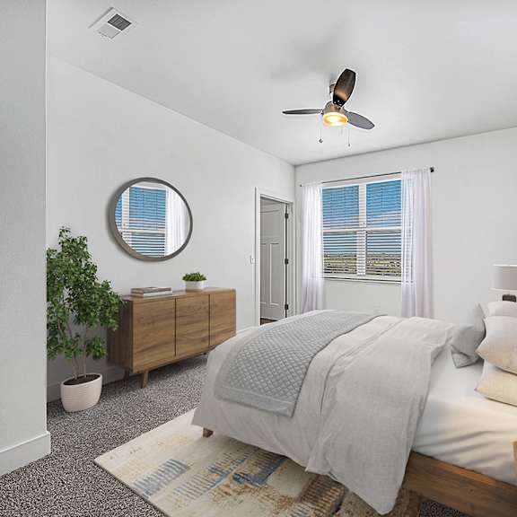 Thumbnail 11 of 13 A bedroom with a bed, a ceiling fan, and a window with blinds at Strathmore Apartment Homes, West Des Moines, Iowa