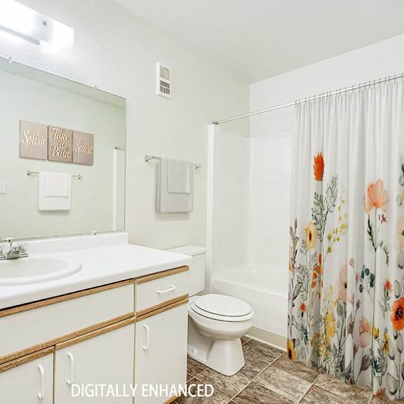 Thumbnail 16 of 20 A spacious bathroom with a large vanity  at Tanglewood Apartments, Oak Creek, WI