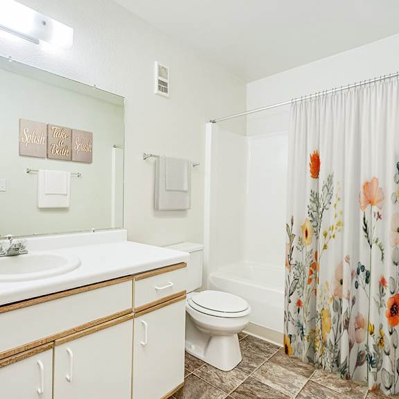 Thumbnail 15 of 19 A spacious bathroom with a large vanity  at Tanglewood Apartments, Oak Creek, WI