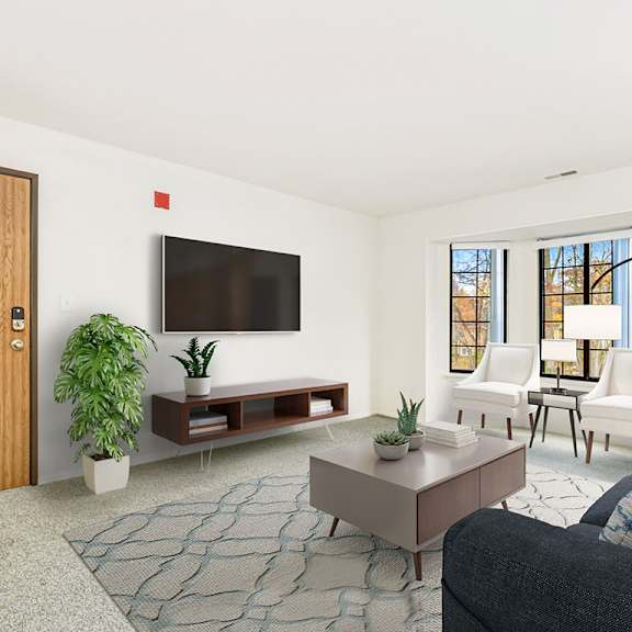 Thumbnail 4 of 19 A living room with a bay window, a couch, and a rug  at Tanglewood Apartments, Oak Creek, WI