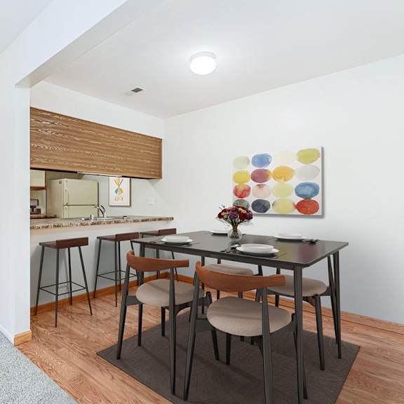 Thumbnail 8 of 19 A dining room and a kitchen  at Tanglewood Apartments, Oak Creek, WI