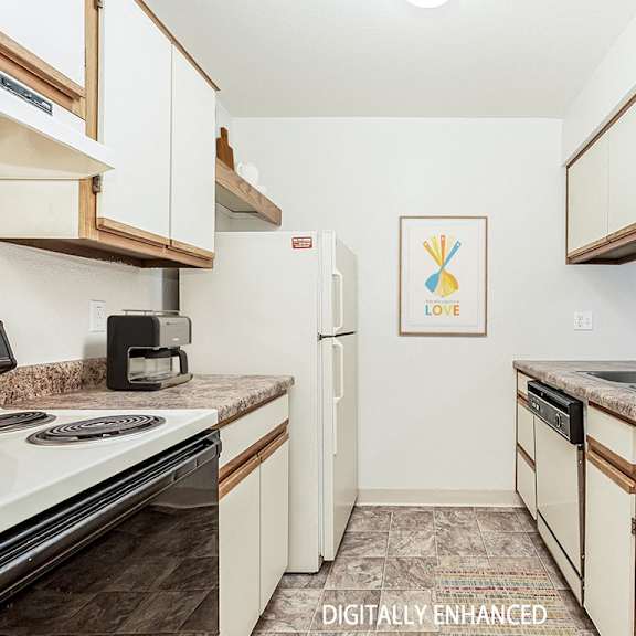 Thumbnail 12 of 20 A galley style kitchen with a dishwasher  at Tanglewood Apartments, Oak Creek, WI