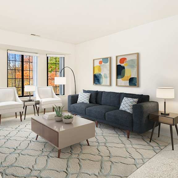 Thumbnail 3 of 19 A living room with a bay window,  grey couch, and a coffee table  at Tanglewood Apartments, Oak Creek, WI