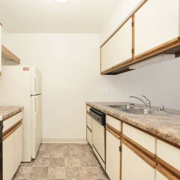 Thumbnail 6 of 11 a kitchen with a dishwasher at Tanglewood Apartments, Oak Creek, WI