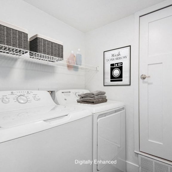 Thumbnail 7 of 15 laundry room with a washer and dryer at The Crossings Apartments, Michigan, 49508