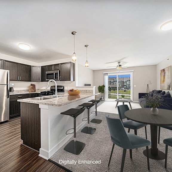 Thumbnail 3 of 17 A kitchen with a refrigerator, a counter, and a dining table at Trade Winds Apartment Homes, Elkhorn, NE