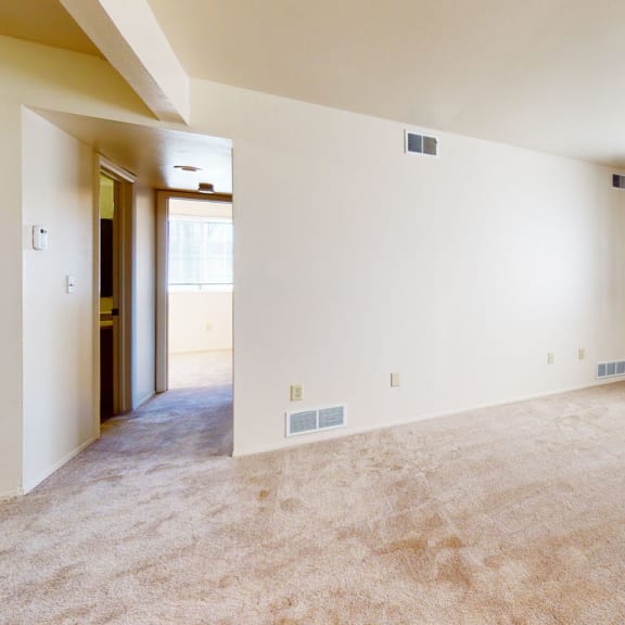 Thumbnail 3 of 7 A garden style living room with carpeting at Walnut Trail Apartments, Portage, 49002