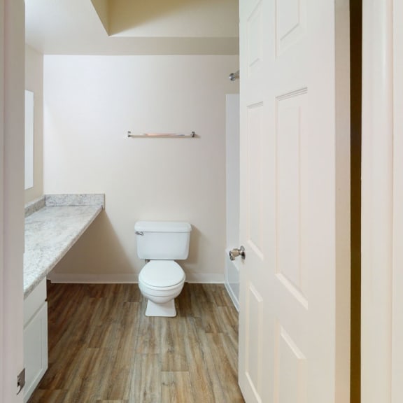 Thumbnail 6 of 8 a bathroom with a toilet and a sink at Walnut Trail Apartments, Michigan, 49002
