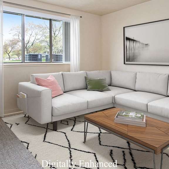 Thumbnail 3 of 6 A living room with a grey couch, a wooden coffee table, and a large window with curtains at Walnut Trail Apartments, Portage, MI, 49002