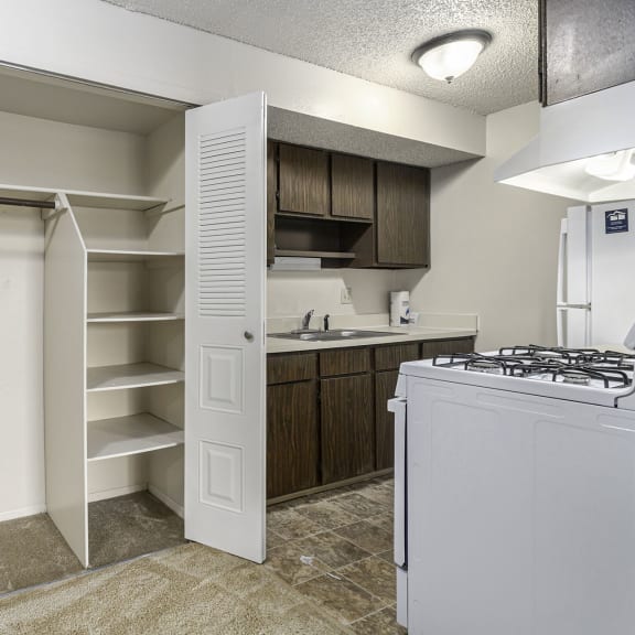 Thumbnail 5 of 12 Kitchen and a large closet at Waverly Park Apartments in Lansing, MI 48911