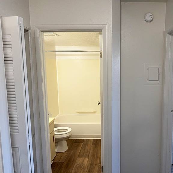 Thumbnail 10 of 11 A bathroom with a toilet and a bathtub at Waverly Park Apartments, Lansing