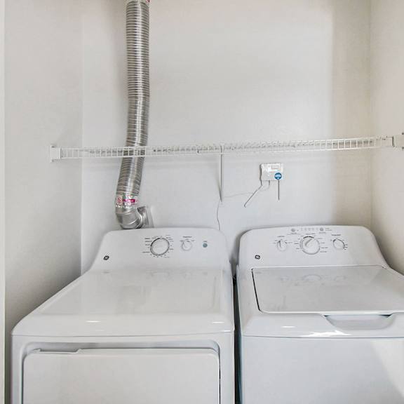 Thumbnail 9 of 12 A full size washer and dryer at West Hampton Park Apartments in Elkhorn, NE 68022