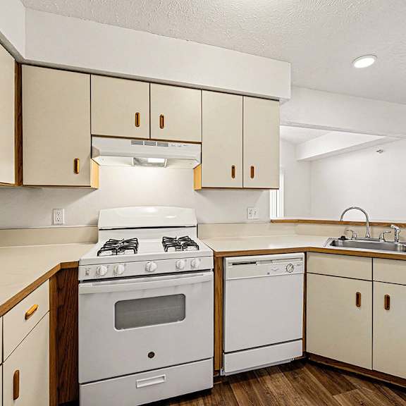 Thumbnail 8 of 17 A kitchen with a white gas stove and dishwasher  at West Hampton Park Apartment Homes, Nebraska, 68022