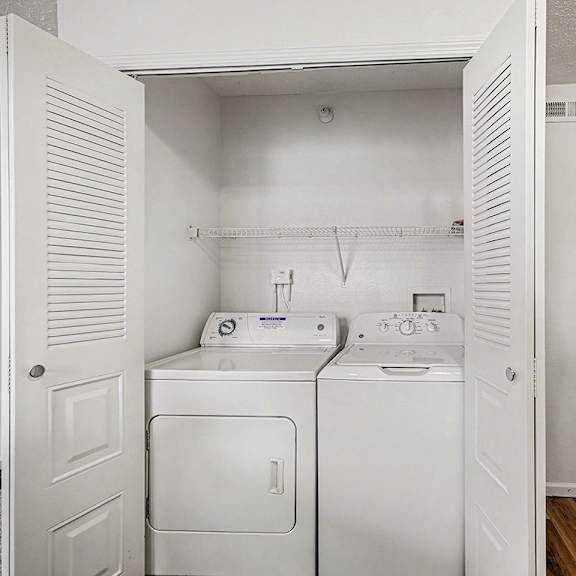 Thumbnail 9 of 17 A laundry area with a washer and dryer  at West Hampton Park Apartment Homes, Nebraska, 68022
