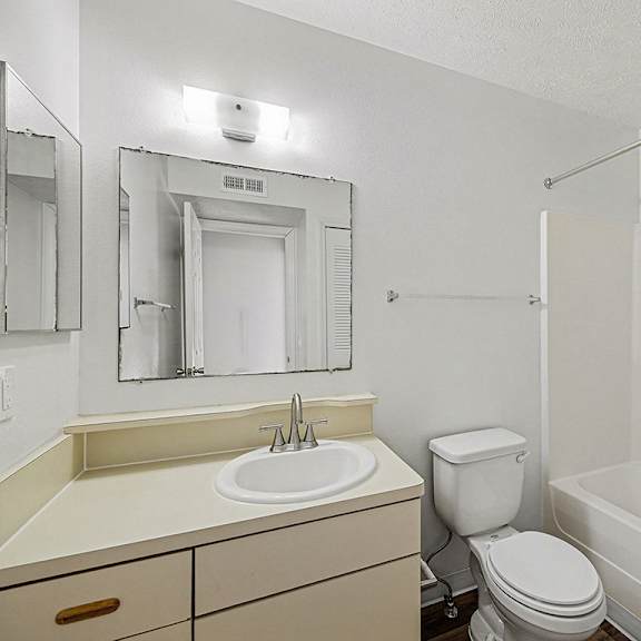 Thumbnail 12 of 19 A white bathroom with a sink, toilet, and bathtub  at West Hampton Park Apartment Homes, Nebraska, 68022
