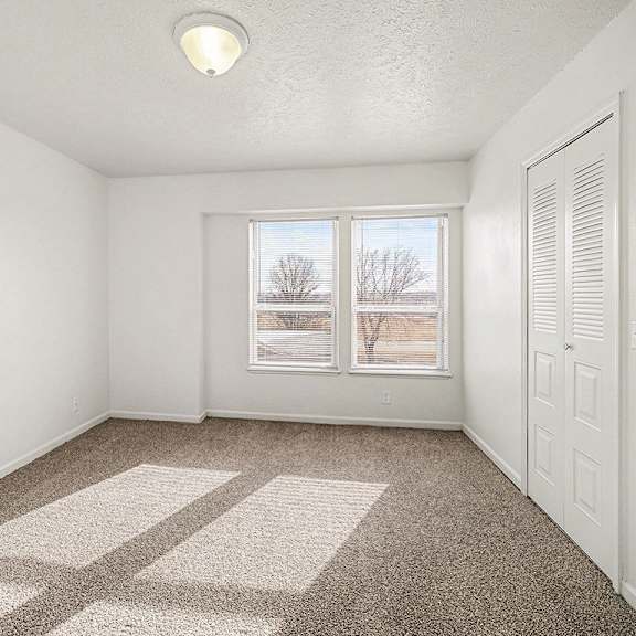 Thumbnail 13 of 19 A bedroom with a carpeted floor and a window  at West Hampton Park Apartment Homes, Nebraska, 68022