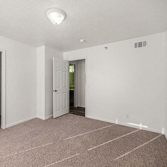 Thumbnail 14 of 19 A bedroom with a carpeted floor and a walk-in closet  at West Hampton Park Apartment Homes, Nebraska, 68022