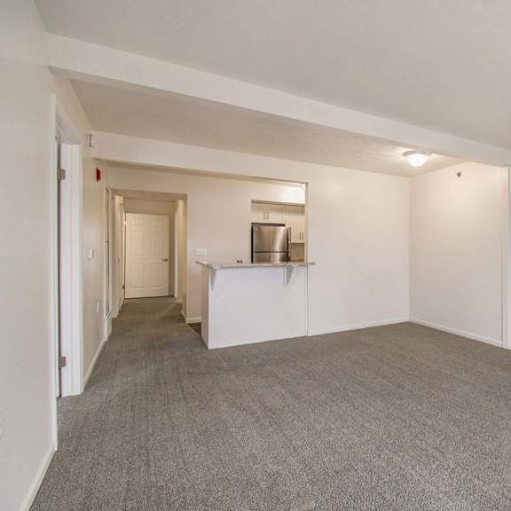 Thumbnail 5 of 20 A dining room with a carpeted floor at West Hampton Park Apartments in Elkhorn, NE 68022