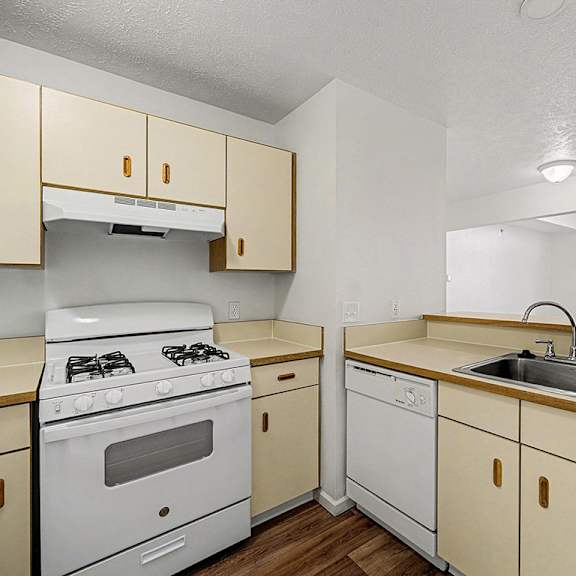 Thumbnail 6 of 19 A kitchen with a white stove and dishwasher  at West Hampton Park Apartment Homes, Nebraska, 68022