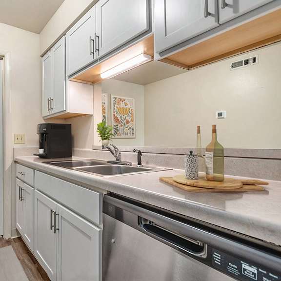 Thumbnail 6 of 8 An upgraded kitchen with pantry at West Wind Apartments in Fort Wayne, IN