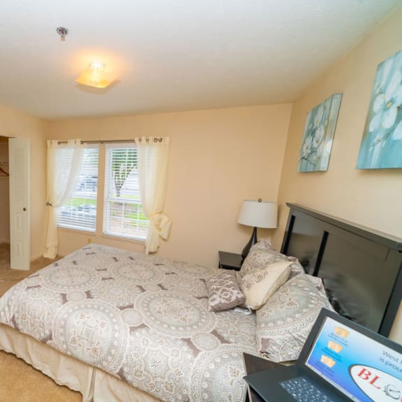 Thumbnail 13 of 14 A bedroom with a walk in closet with organizers at West Hampton Park Apartment Homes, Elkhorn, Nebraska