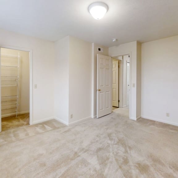 Thumbnail 15 of 20 A bedroom with a walk in closet at West Hampton Park Apartment Homes, Elkhorn, Nebraska