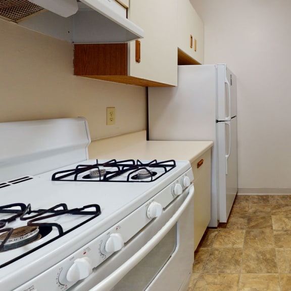 Thumbnail 8 of 13 Well equipped kitchen at Wingate Apartments, Kentwood
