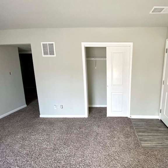 a room with a white door and a window.