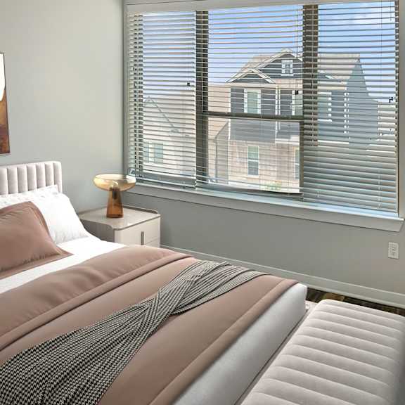 Thumbnail 5 of 5 A bedroom with a large bed and a window with blinds.