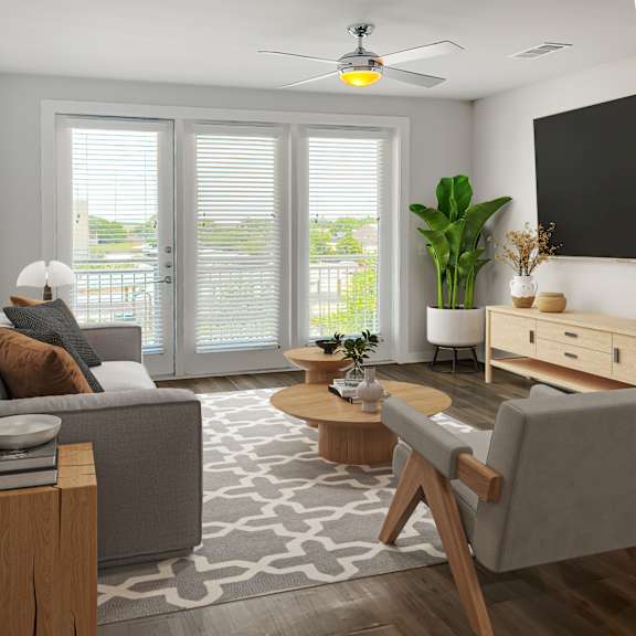 Thumbnail 3 of 5 A living room with a grey couch, a wooden coffee table, and a ceiling fan.