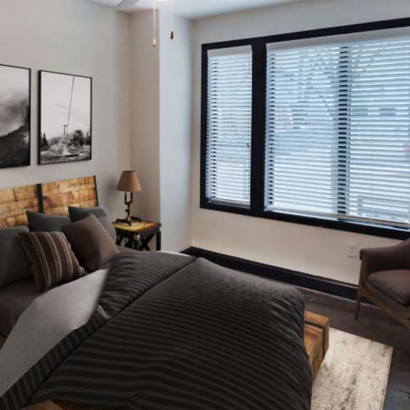 Thumbnail 5 of 7 A bedroom with a large bed and two lamps.