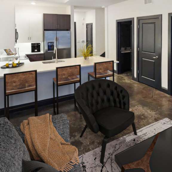Thumbnail 3 of 7 A modern living room with a black chair and a grey couch.