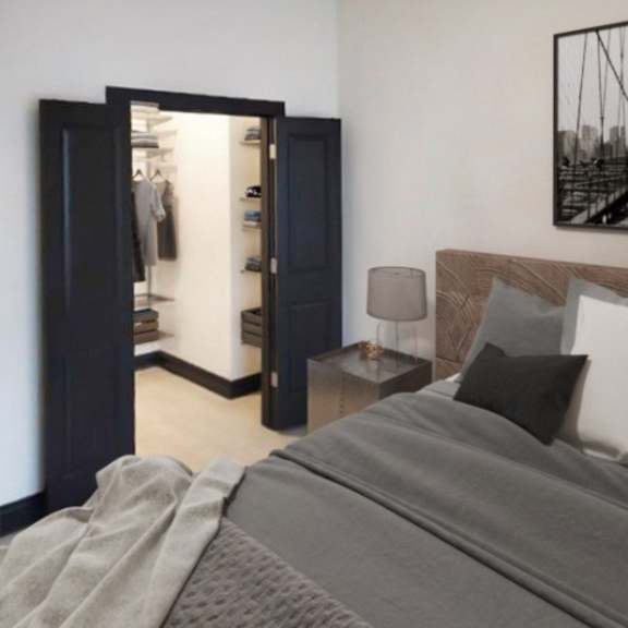 Thumbnail 7 of 7 A bedroom with a large bed and a bridge picture on the wall.
