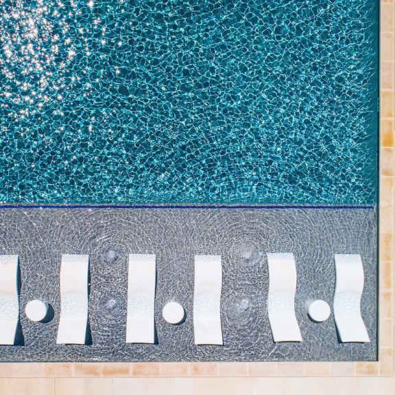 A pool with a metal grate over it.