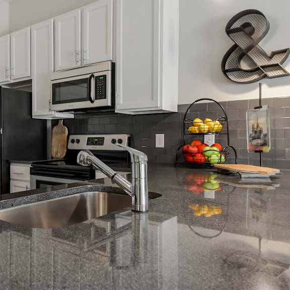 a kitchen with stainless steel appliances and a sink