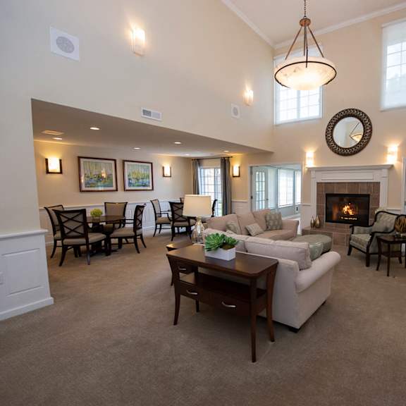 a living room with a fireplace and a couch.