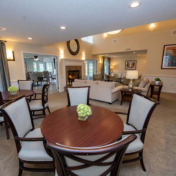 a dining room with a wooden table and chairs.