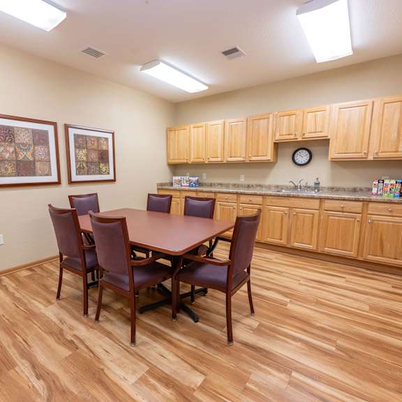 a kitchen with a table and chairs.