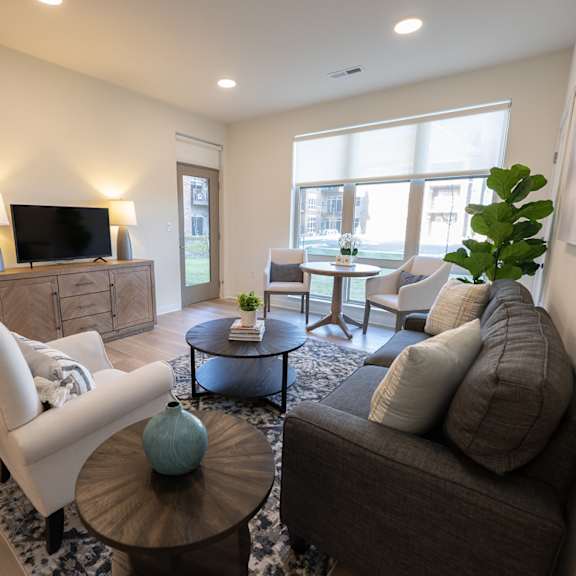 a living room with a couch and a table and a tv