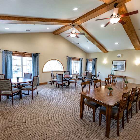 a large room with a dining table and chairs.