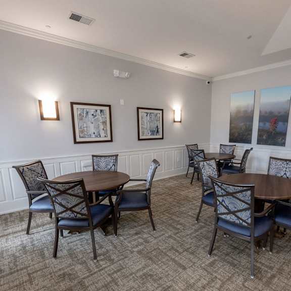 a dining room with tables and chairs