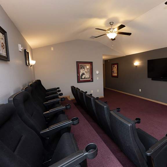 a room filled with furniture and a flat screen tv